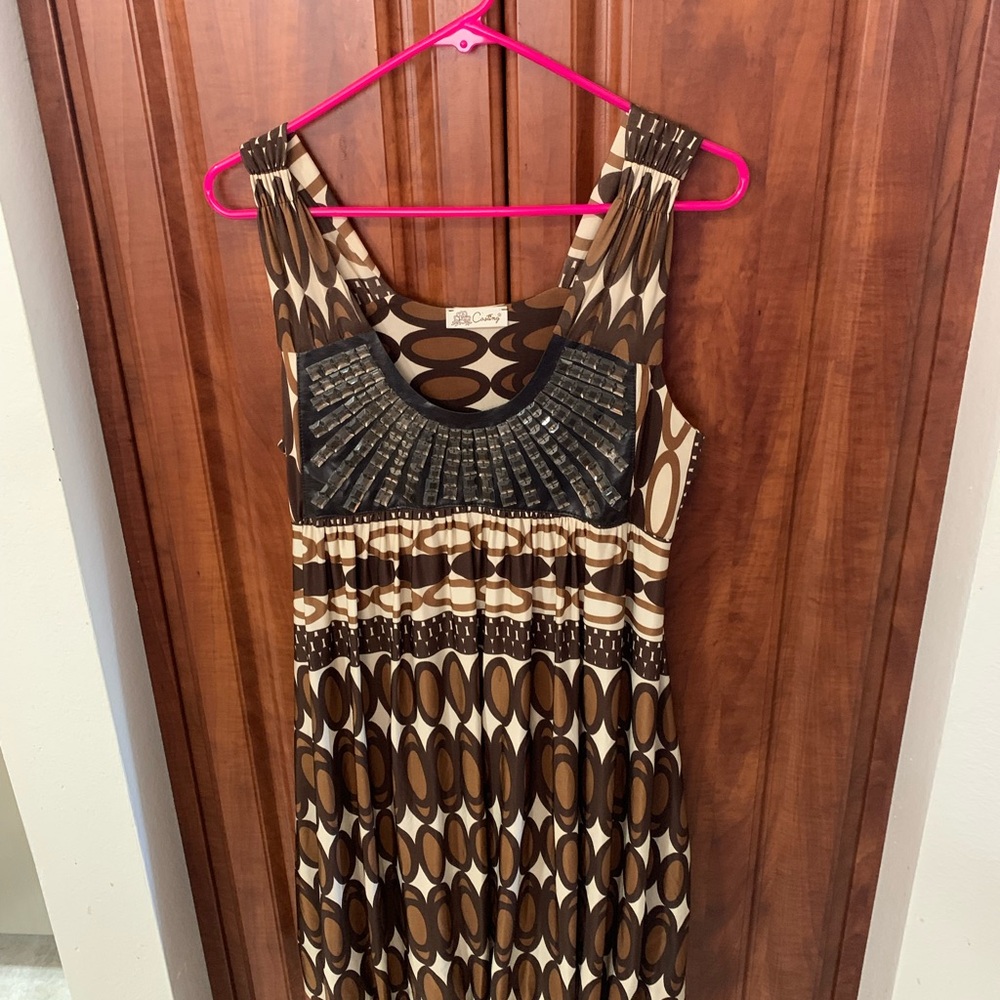 SLEEVELESS INDY BEADED DECORATED TOP GATHERED HEM AT BOTTOM  WEAR WITH LEGGINGS